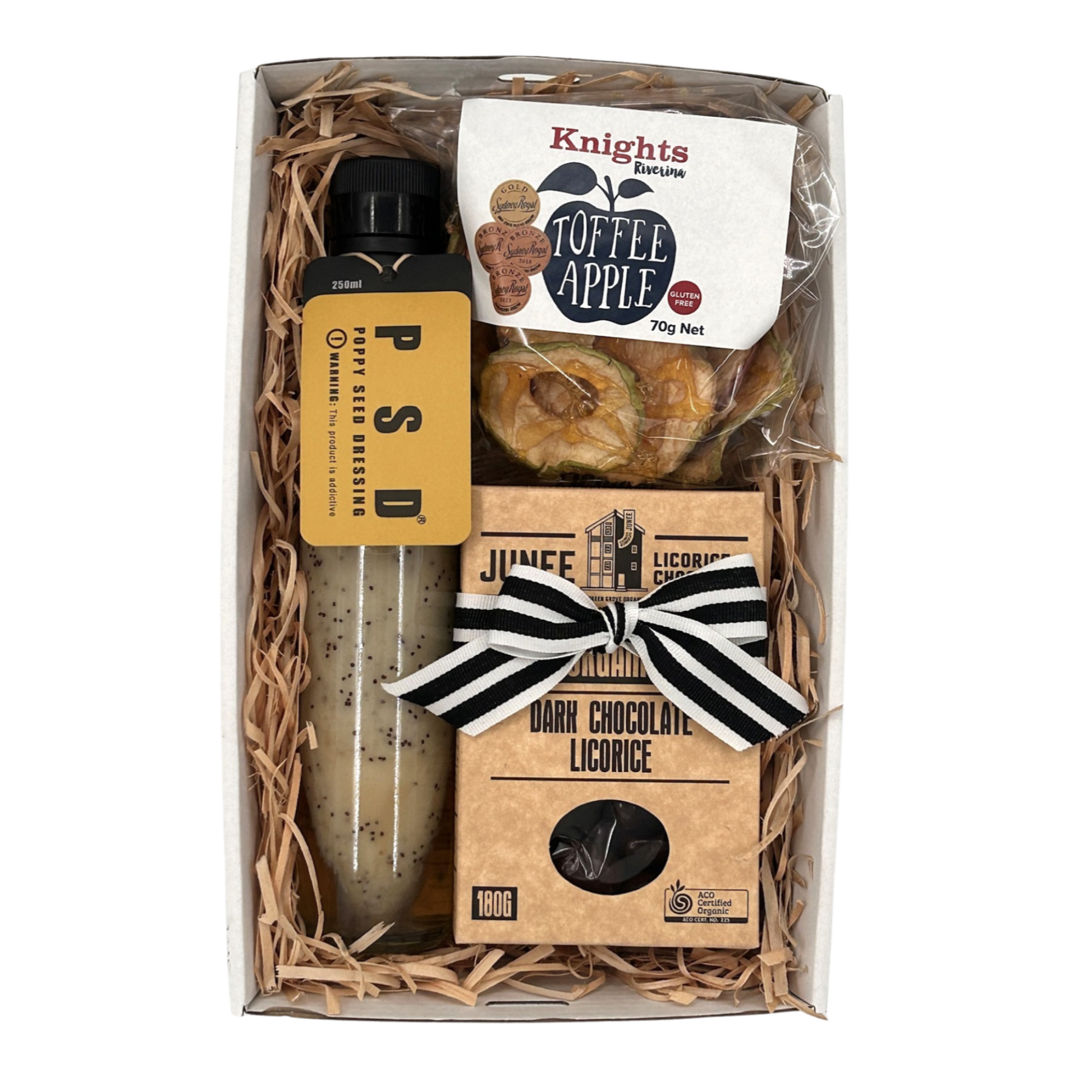 Gift set with licorice, toffee apple, and dark chocolate licorice in a box.